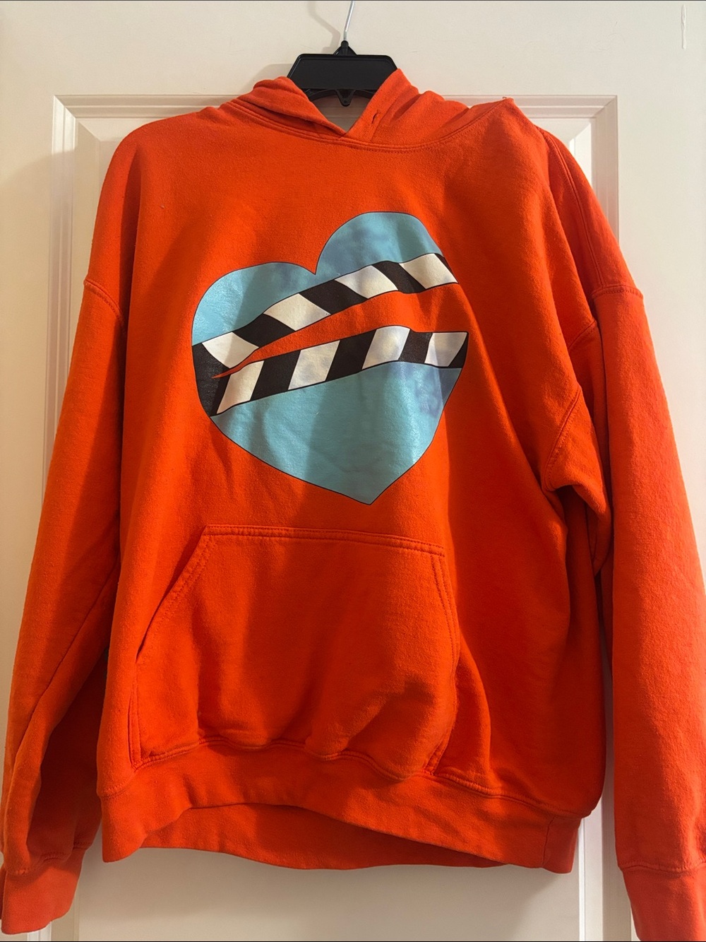 Rock Out Bright Orange Hoodie with Blue Heart Graphic
